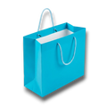 Bolsa de regalo mediana PartyStore en color azul agua con asas de cuerda trenzada y acabado boutique