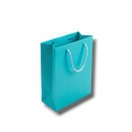 Bolsa de regalo mediana PartyStore color aqua con asas de cordón trenzado, vista en ángulo sobre fondo blanco.