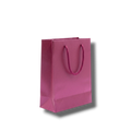 Bolsa de regalo mini de PartyStore en color rosa metálico con asas de cordón trenzado a juego