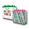 Dos bolsas de regalo PartyStore con diseños navideños coloridos, motivos de árboles y estrellas, y texto festivo.