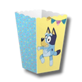Caja de palomitas PartyStore con diseño de Bluey, fondo amarillo y patrón de confeti azul para fiestas infantiles