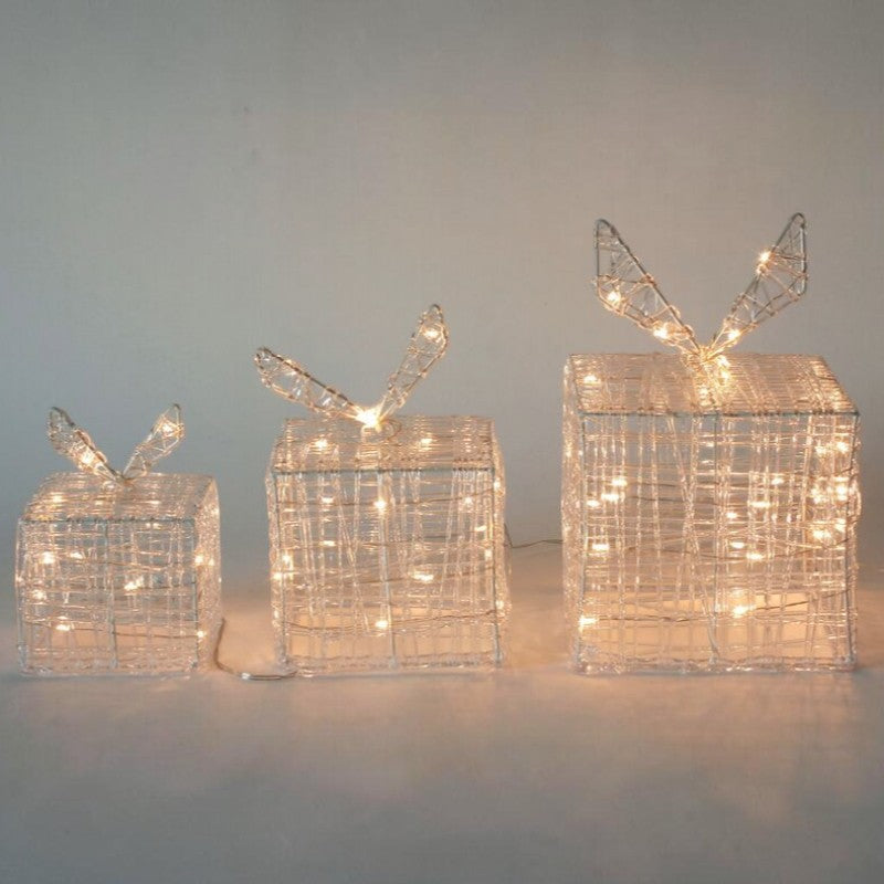 Cajas de regalo luminosas PartyStore con estructura de alambre plateado y luces LED cálidas para decoración navideña