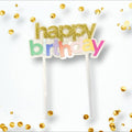 Cake topper PartyStore con letras happy birthday en purpurina dorada y colores pastel sobre fondo blanco