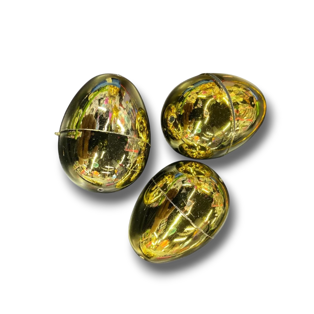 Tres huevos de Pascua dorados brillantes de PartyStore, ideales para decoraciones festivas y rellenos de dulces.