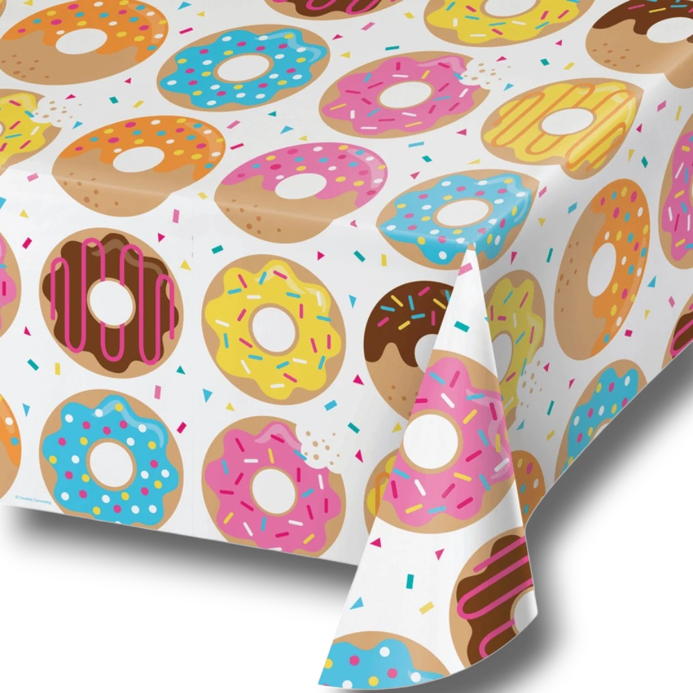 Mantel de mesa PartyStore con estampado colorido de donas glaseadas y chispas de colores sobre fondo blanco