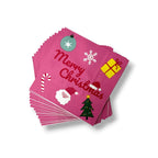 Servilletas PartyStore de papel color rosa con diseño navideño de Santa Claus, árbol, regalo y texto Merry Christmas