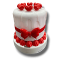 Vela PartyStore con forma de pastel blanco decorado con corazones y lazo rojo para celebraciones